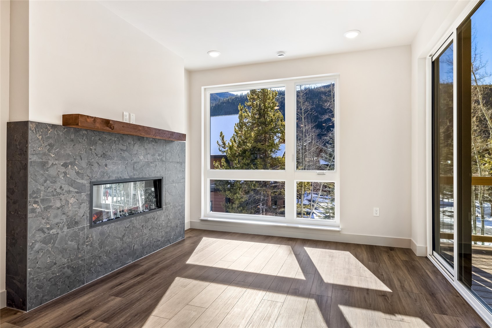 628 Montezuma Road, Unit D2 Keystone, CO 80435 - Photo 2 of 25 wooden floor in an empty room with a window