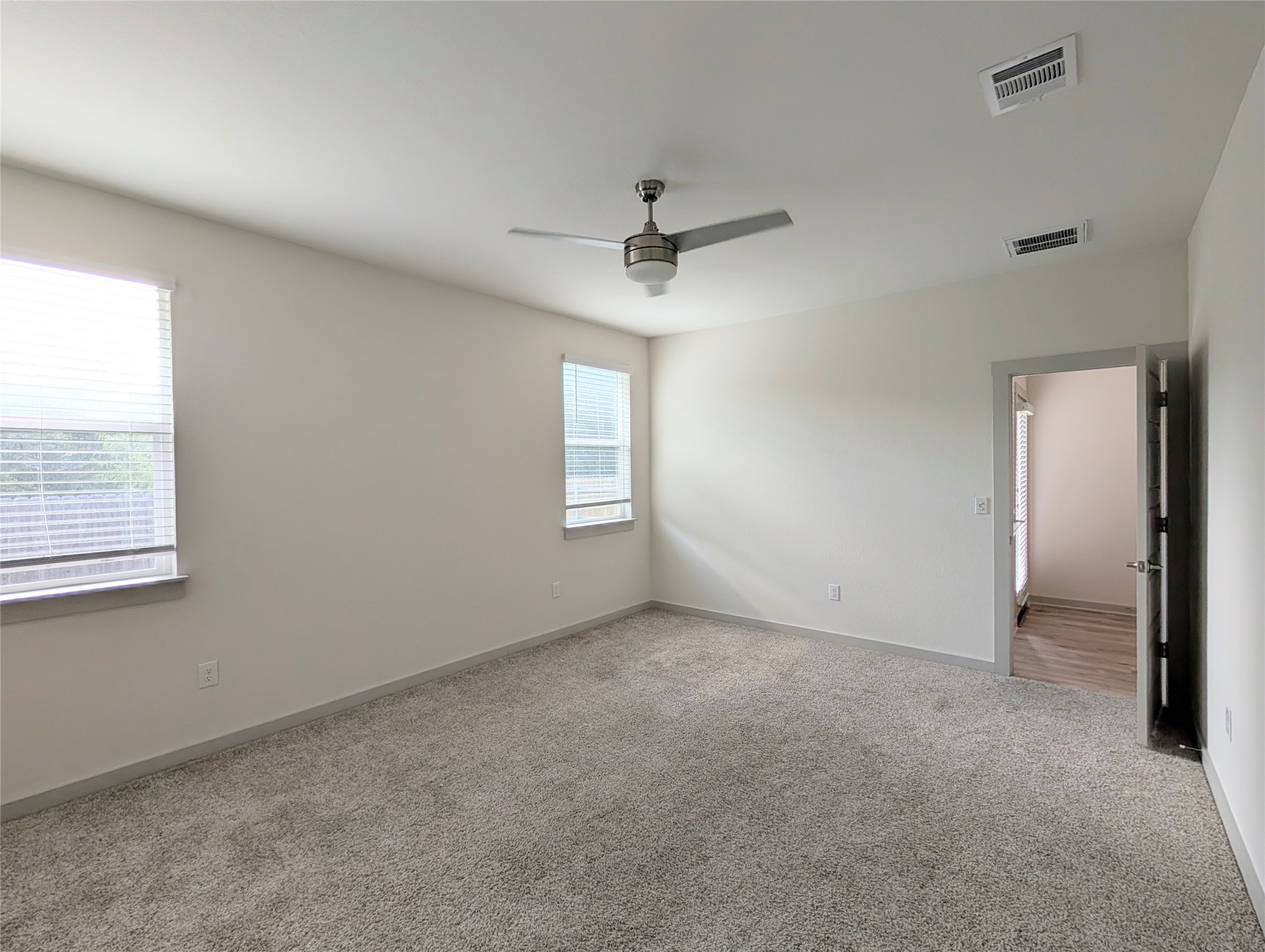 261 Century Plant Road Leander, TX 78641 - Photo 9 of 25 Well-lit living space with soft carpeting and contemporary finishes.