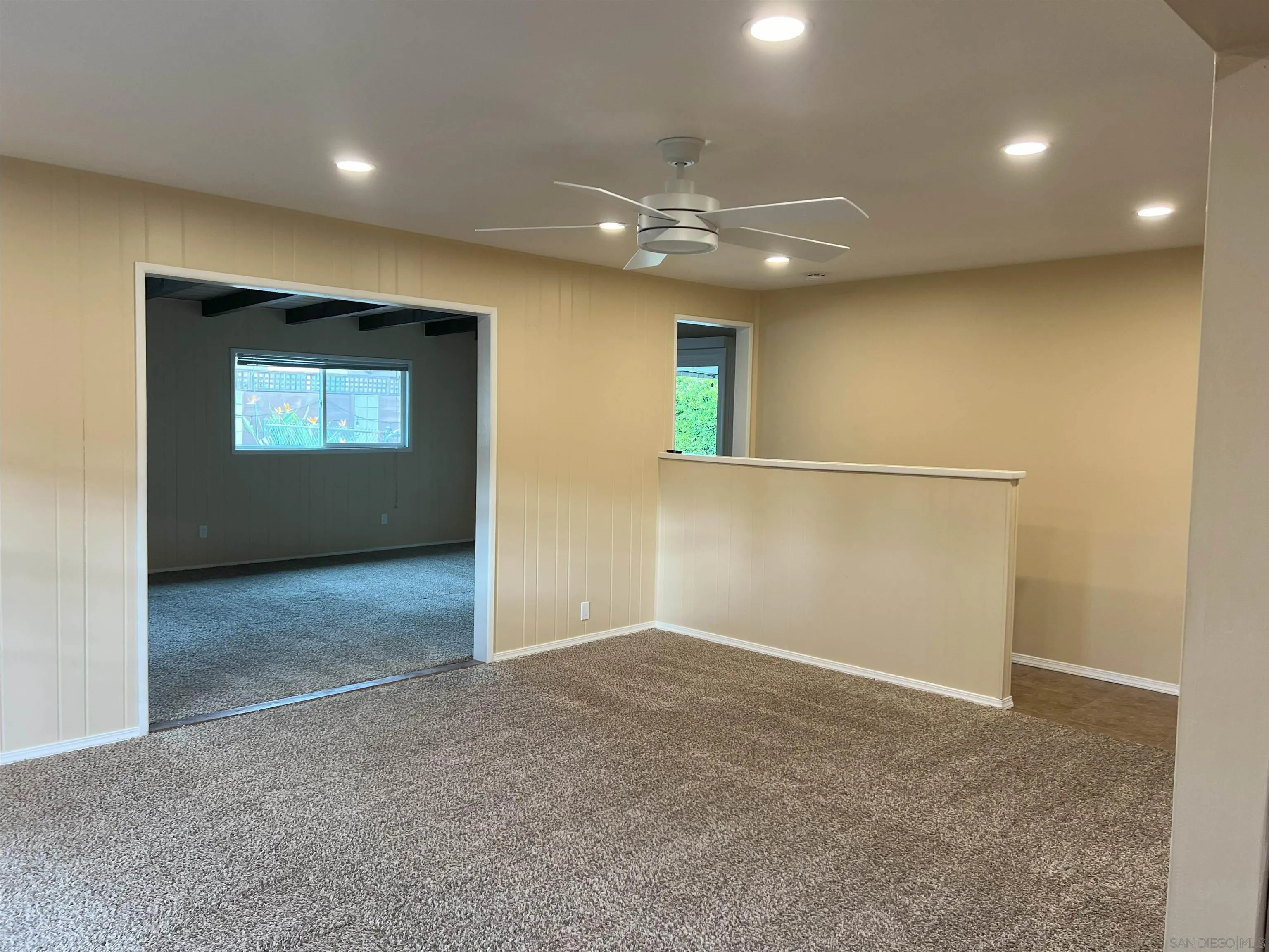 4054 Mt Barnard Avenue San Diego, CA 92111 - Photo 15 of 55 an empty room with a empty space and windows