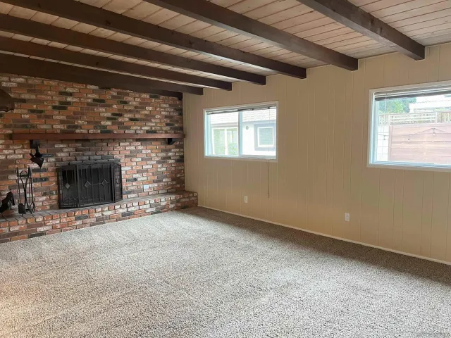 a view of an empty room with a flat screen tv