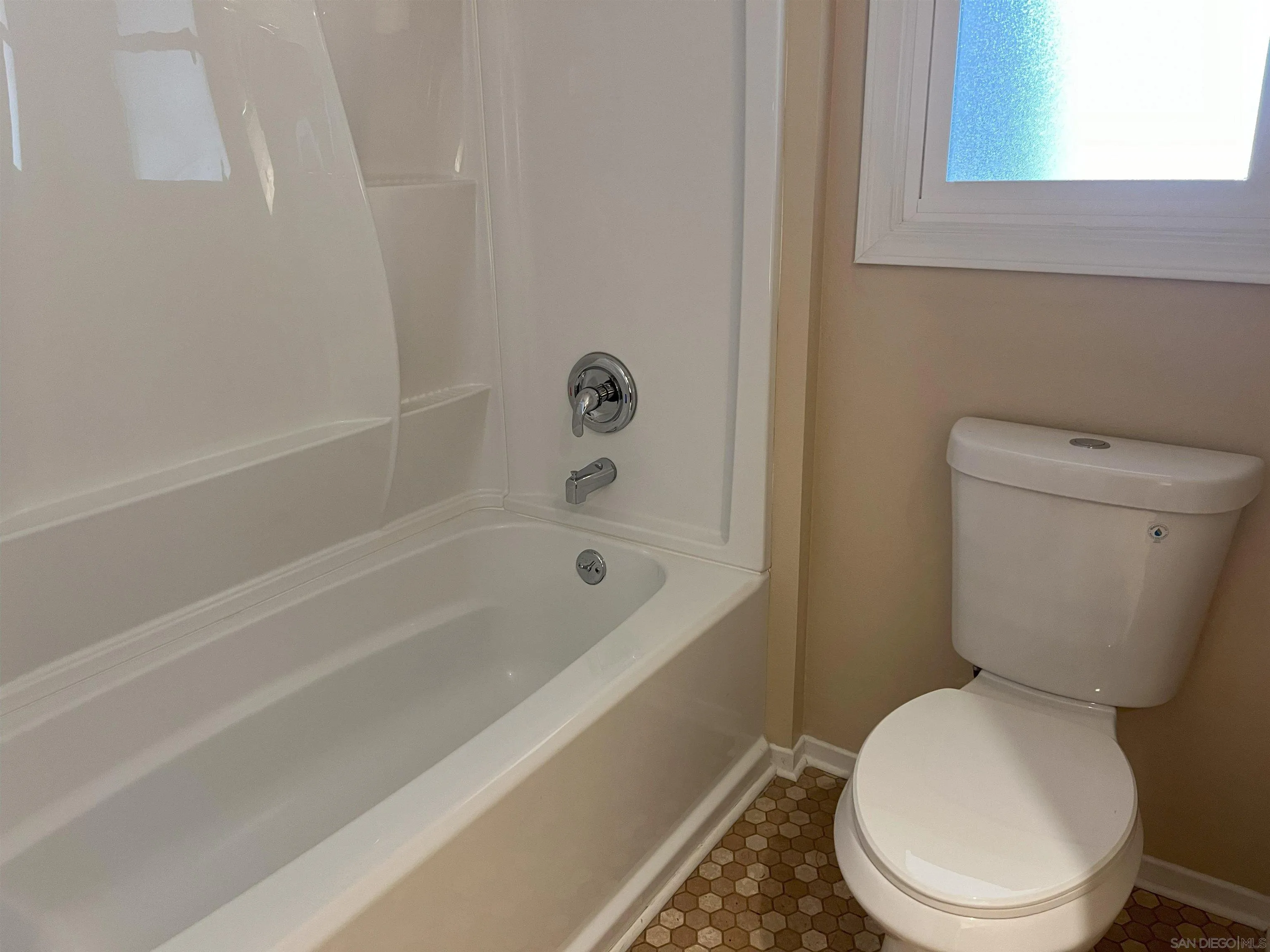 4054 Mt Barnard Avenue San Diego, CA 92111 - Photo 25 of 55 a white toilet sitting next to a bath tub