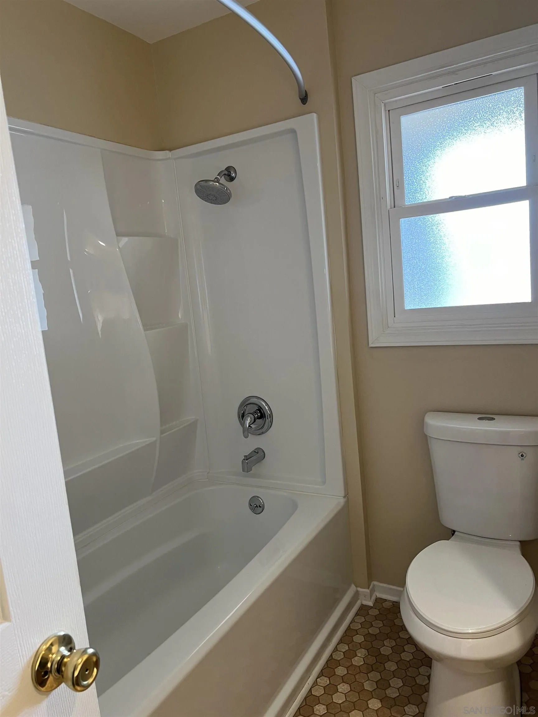 4054 Mt Barnard Avenue San Diego, CA 92111 - Photo 26 of 55 a bathroom with a toilet and a bathtub