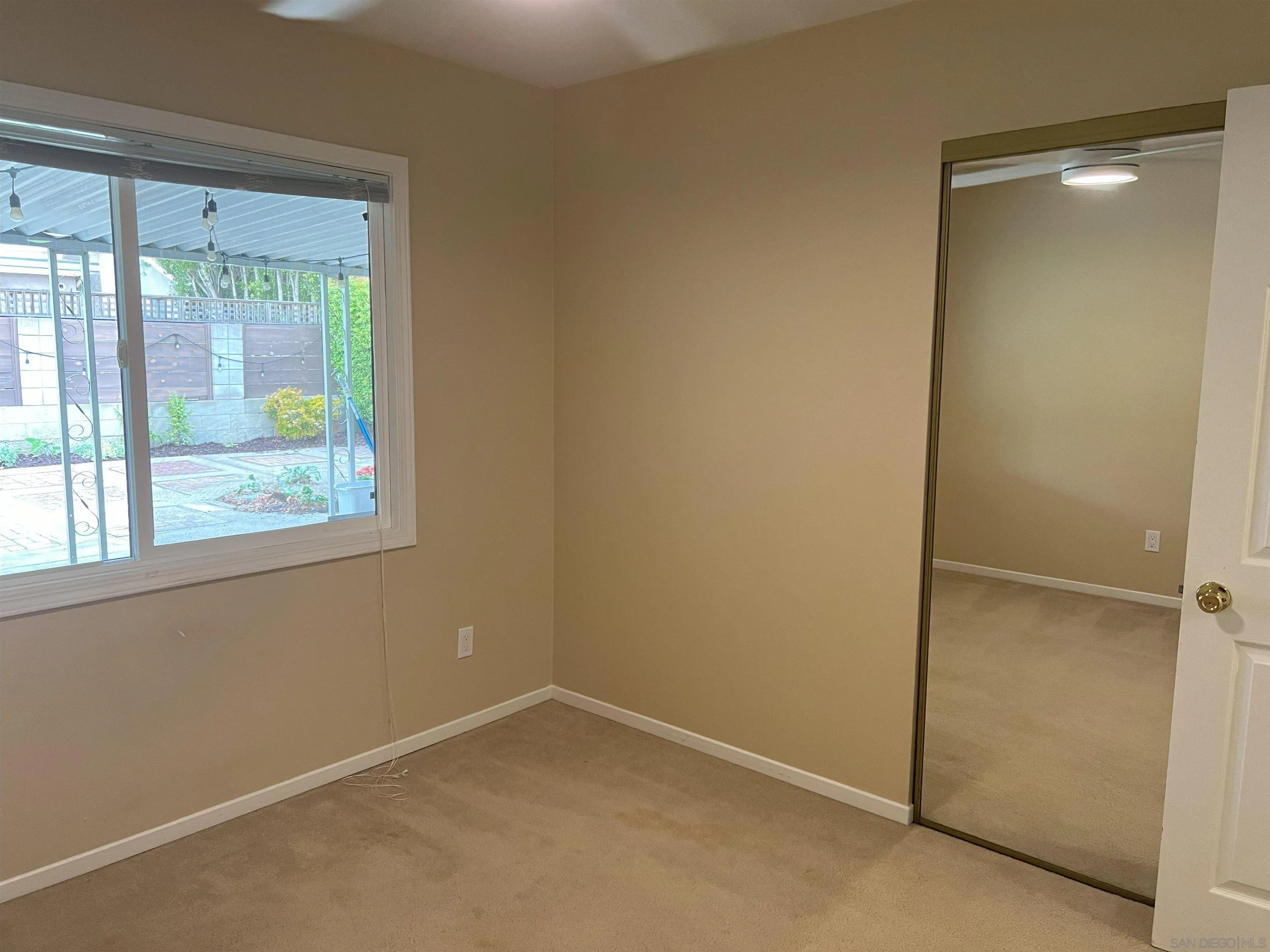 4054 Mt Barnard Avenue San Diego, CA 92111 - Photo 28 of 55 an empty room with a window