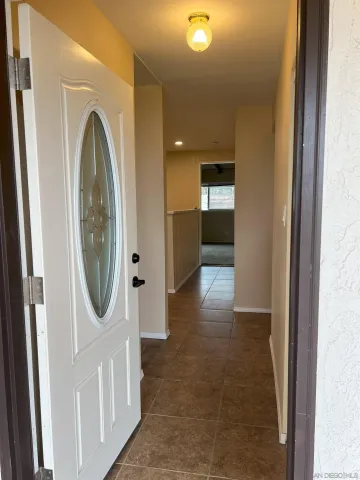 a view of a hallway with a washer and dryer