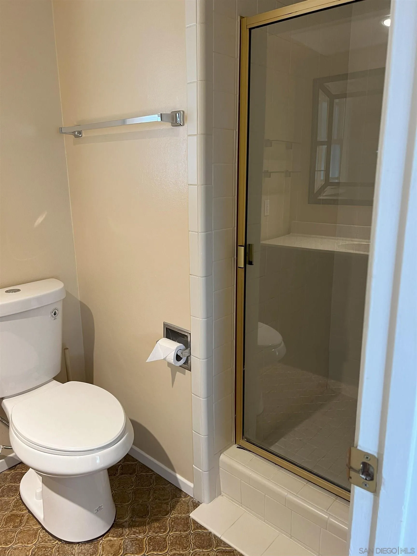 4054 Mt Barnard Avenue San Diego, CA 92111 - Photo 35 of 55 a bathroom with a toilet and a shower