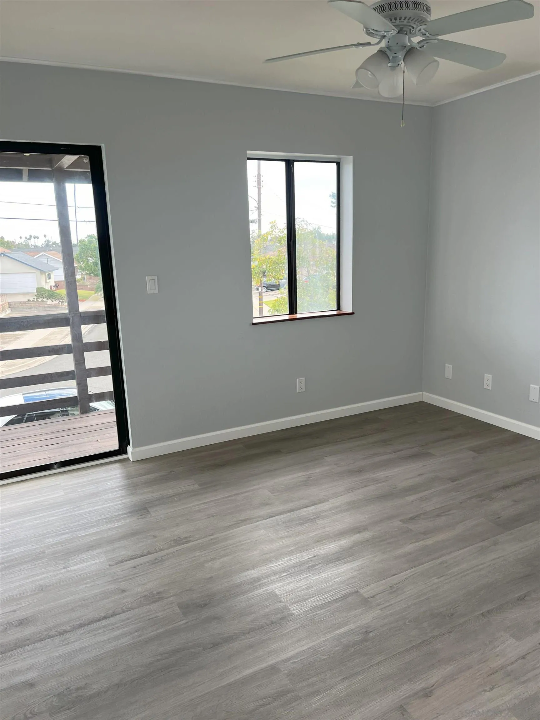 4054 Mt Barnard Avenue San Diego, CA 92111 - Photo 38 of 55 an empty room with wooden floor and windows
