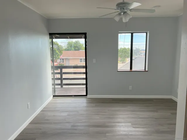 wooden floor in an empty room with a window