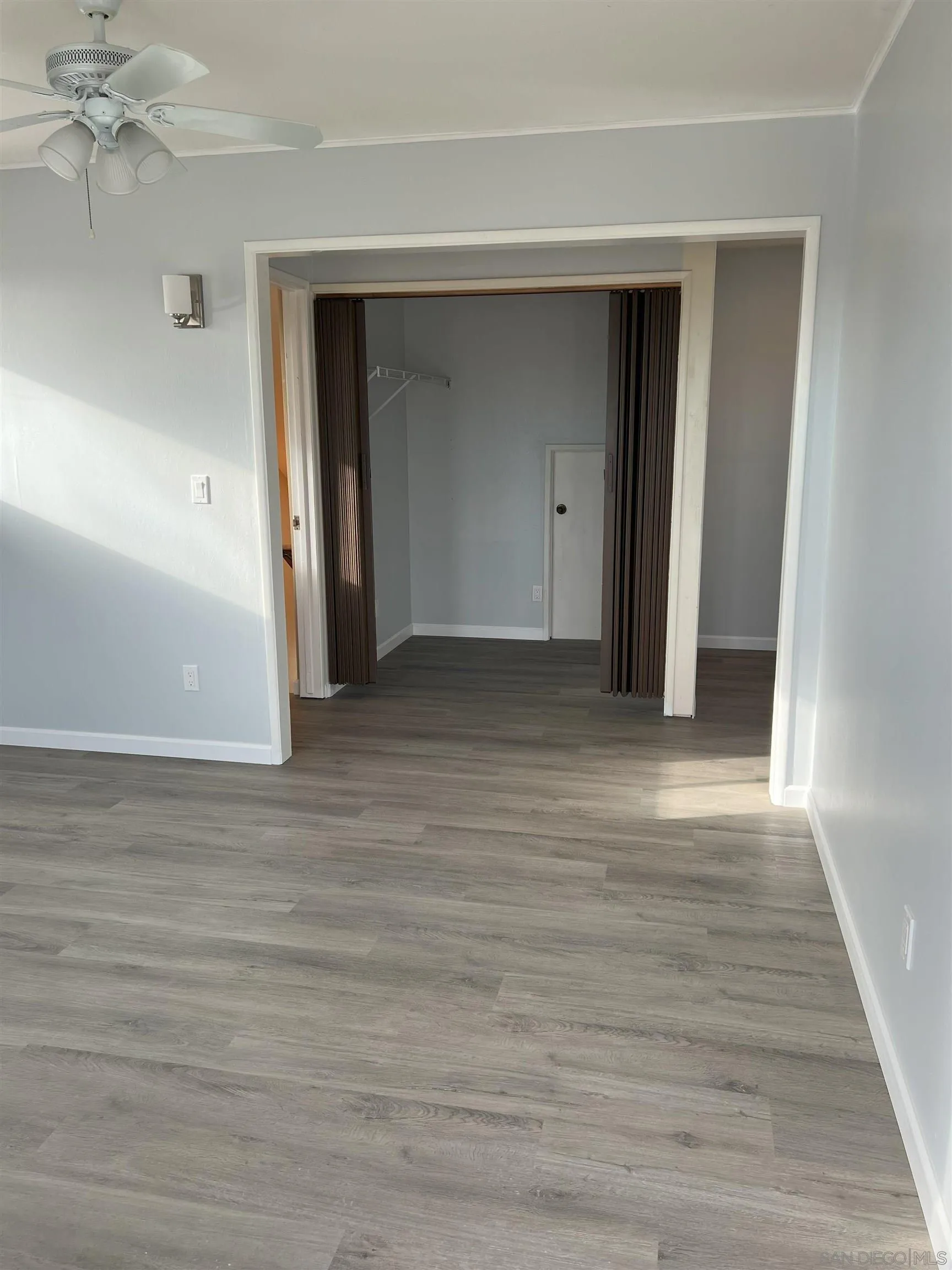 4054 Mt Barnard Avenue San Diego, CA 92111 - Photo 49 of 55 a view of empty room with wooden floor