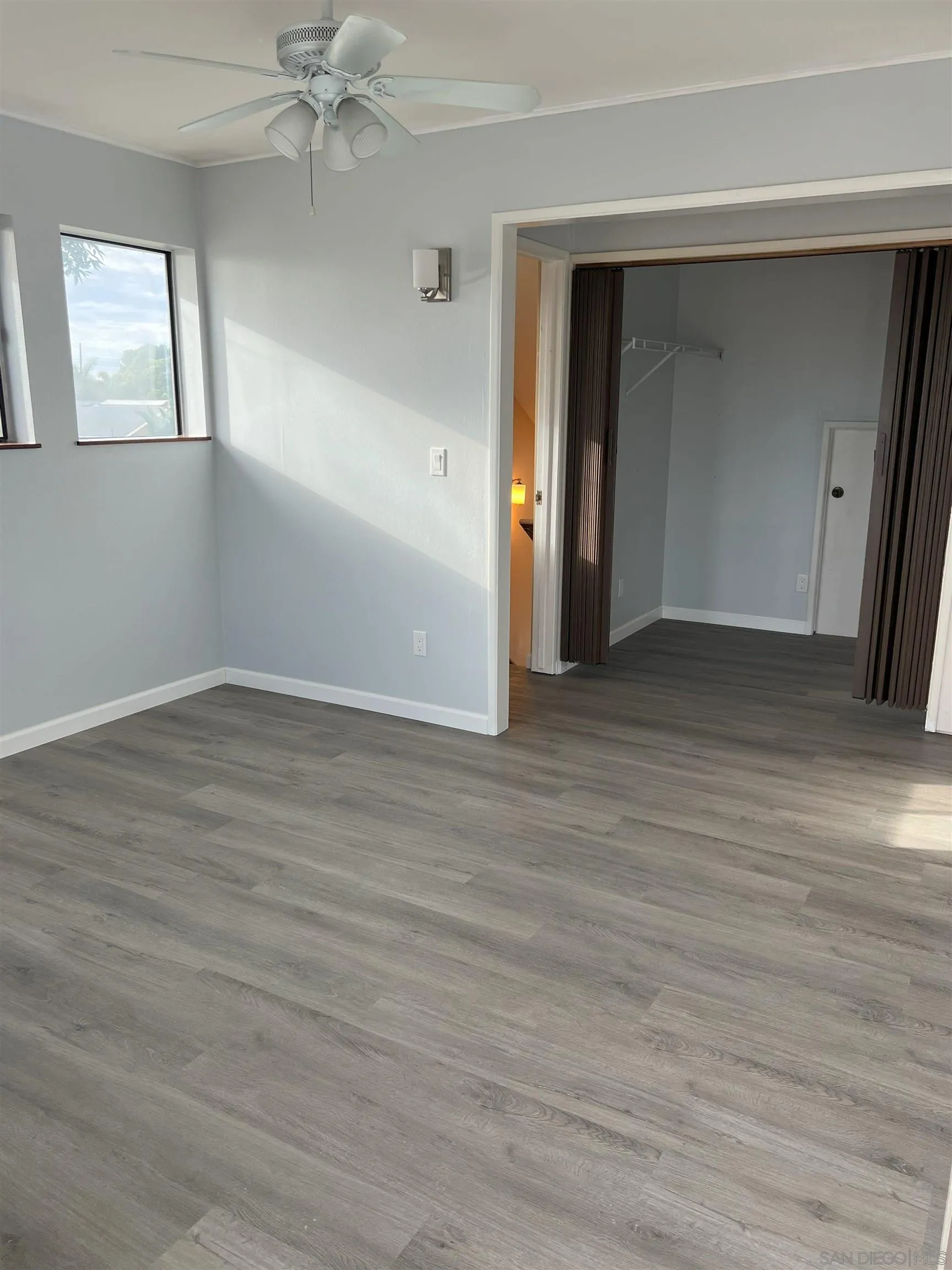 4054 Mt Barnard Avenue San Diego, CA 92111 - Photo 50 of 55 an empty room with wooden floor and closet