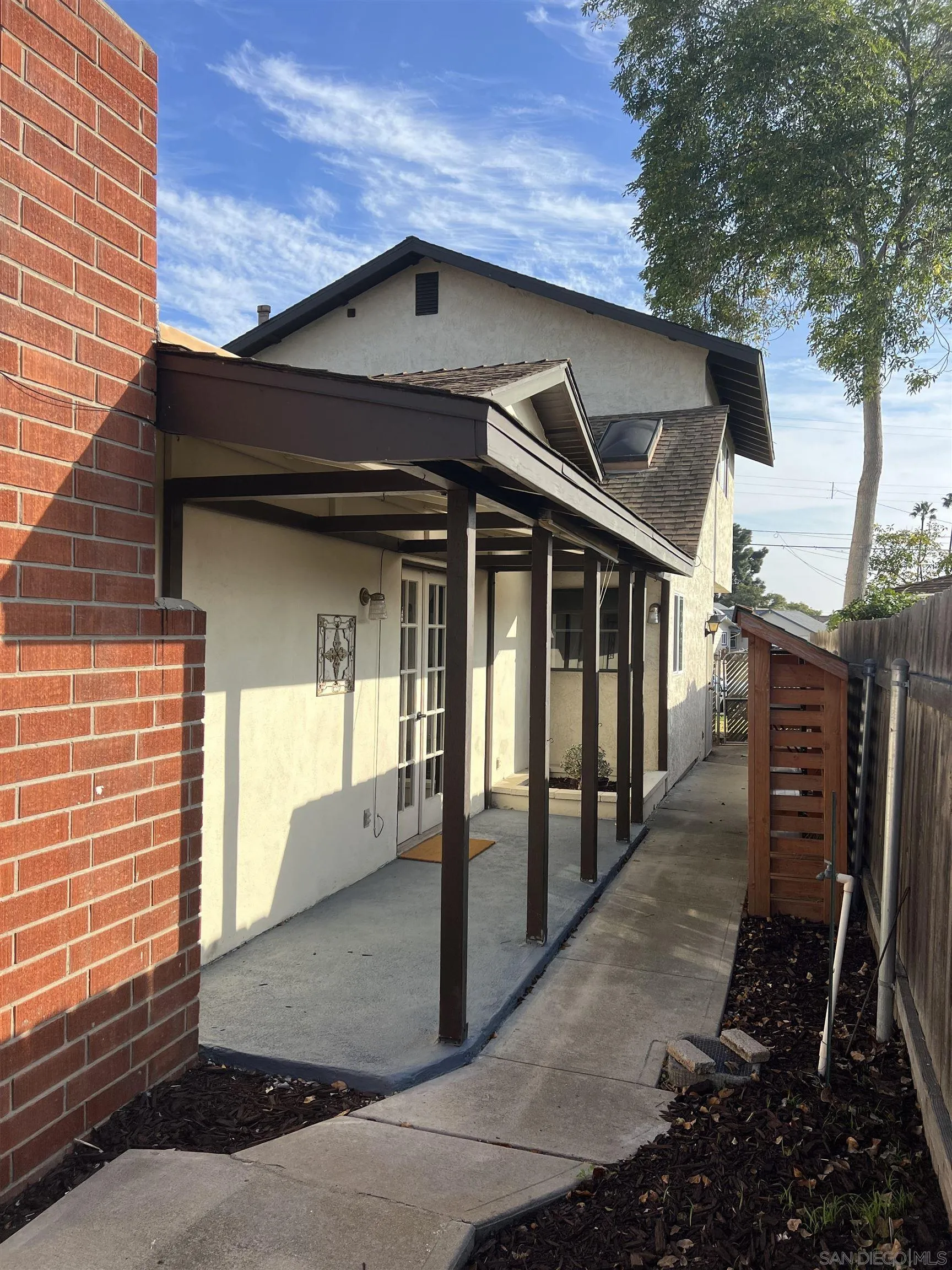 4054 Mt Barnard Avenue San Diego, CA 92111 - Photo 54 of 55 a front view of a house with glass windows