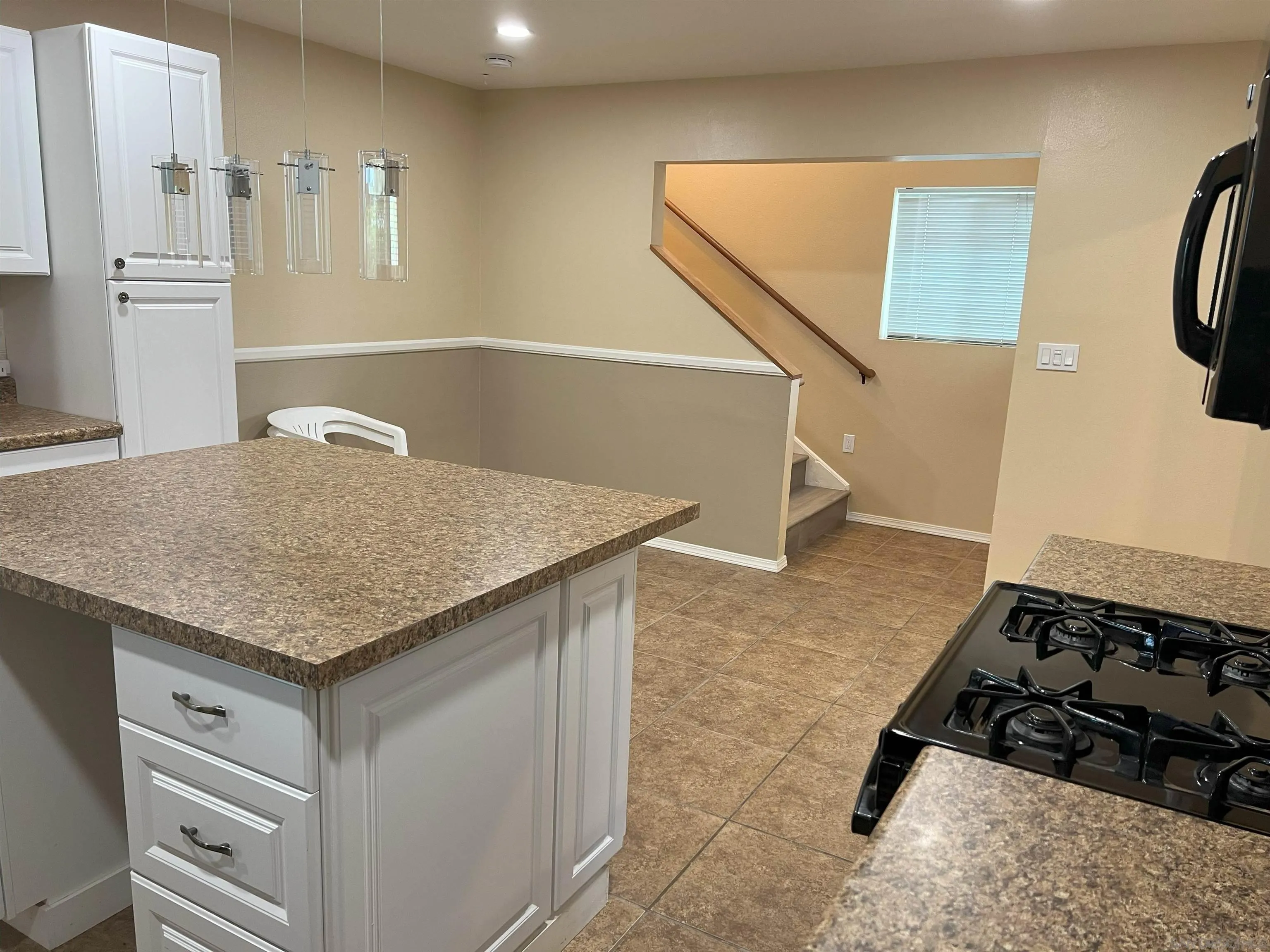 4054 Mt Barnard Avenue San Diego, CA 92111 - Photo 8 of 55 a kitchen with a stove a refrigerator and a sink
