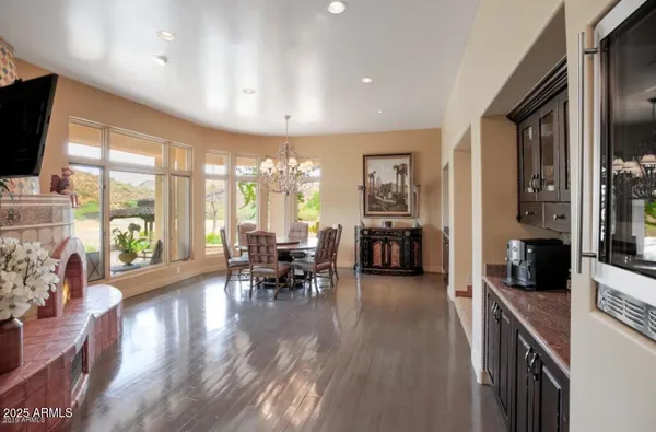 a view of a livingroom with furniture window and wooden floor