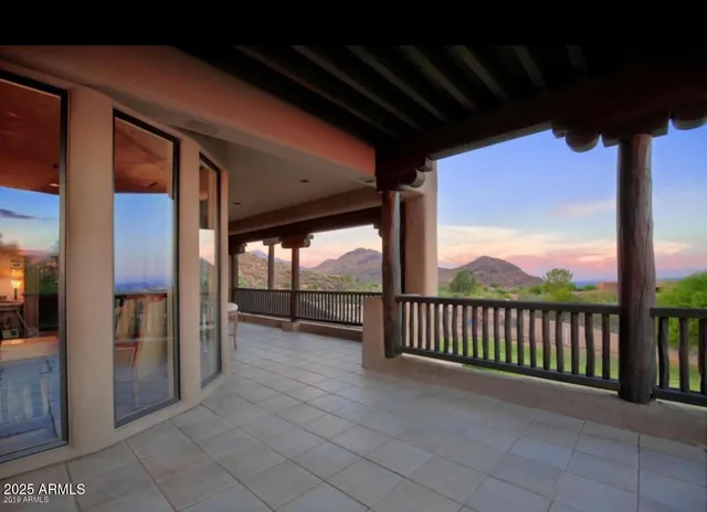 a bath tub sitting in a bathroom next to a window