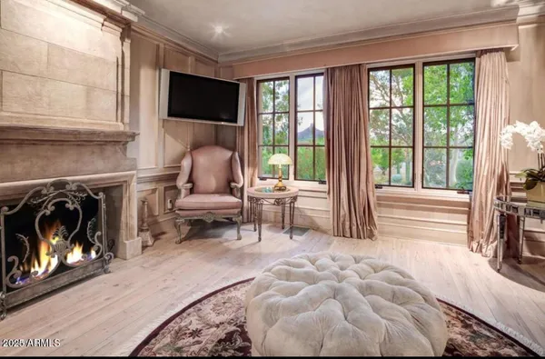 a bedroom with a bed a couch and dresser