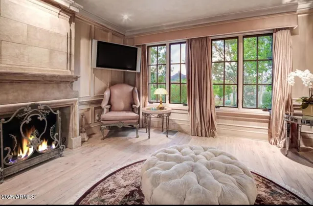 a bedroom with a bed a couch and dresser