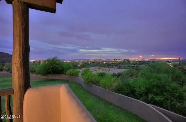 a view of a garden from a balcony
