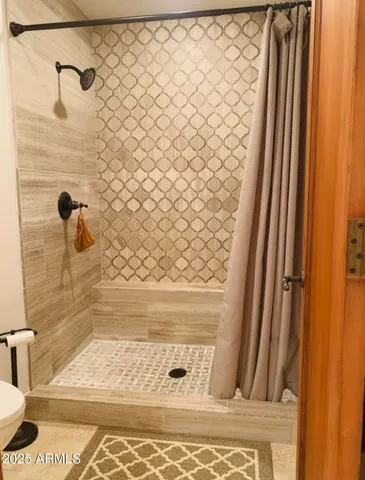 a bathroom with a sink double vanity and a mirror
