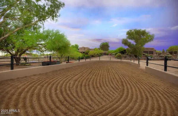 a view of a swimming pool with a couches and lounge chairs