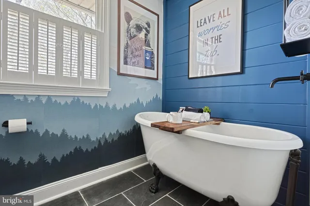 a bedroom with a large bed and a large window