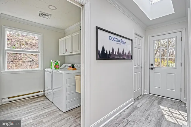 a living room with furniture and a bed
