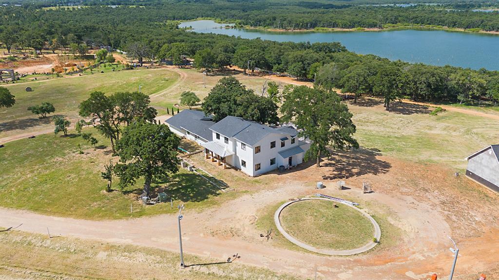 23507 Alexander Road Pilot Point, TX 76258 - Photo 2 of 26 Aerial view of a nearby body of water and a forest