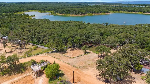 an aerial view of a houses with lake view
