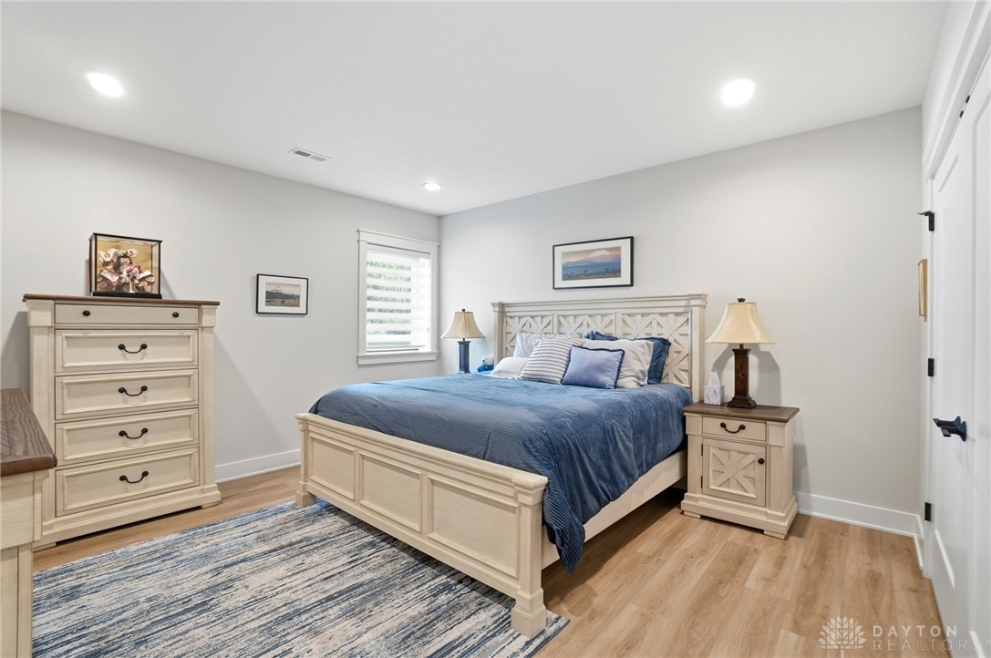 1247 Normandy Rue Dayton, OH 45458 - Photo 52 of 76 This inviting bedroom features light wood flooring and bright lighting, perfect for comfortable living.