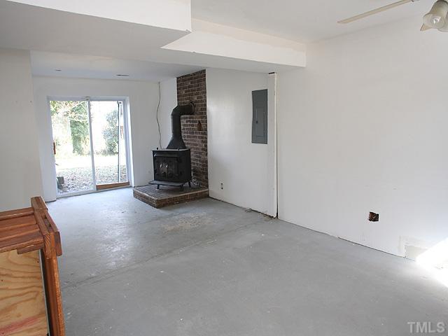 6905 Park Place Raleigh, NC 27616 - Photo 6 of 8 Partially Finished Basement with Wood Stove