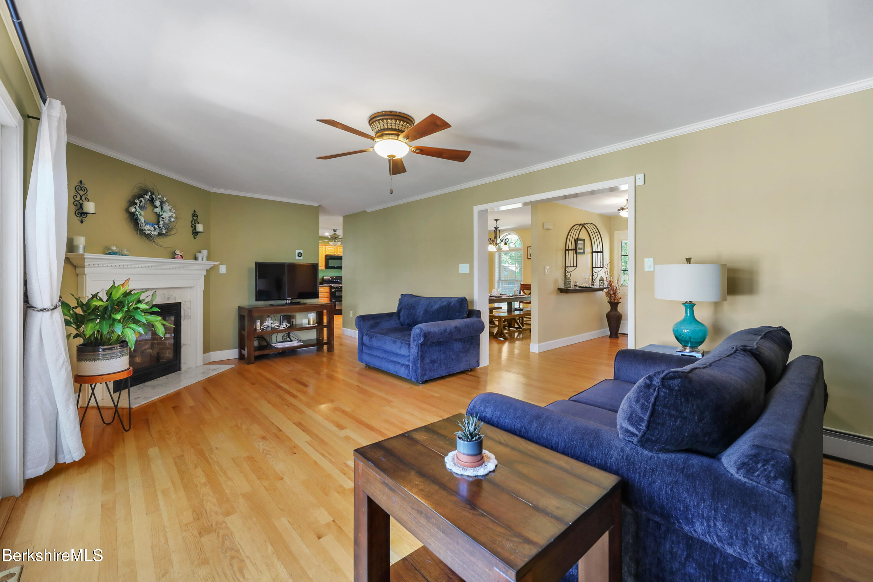 144 East Road Adams, MA 01220 - Photo 18 of 72 a living room with furniture a ceiling fan and a potted plant