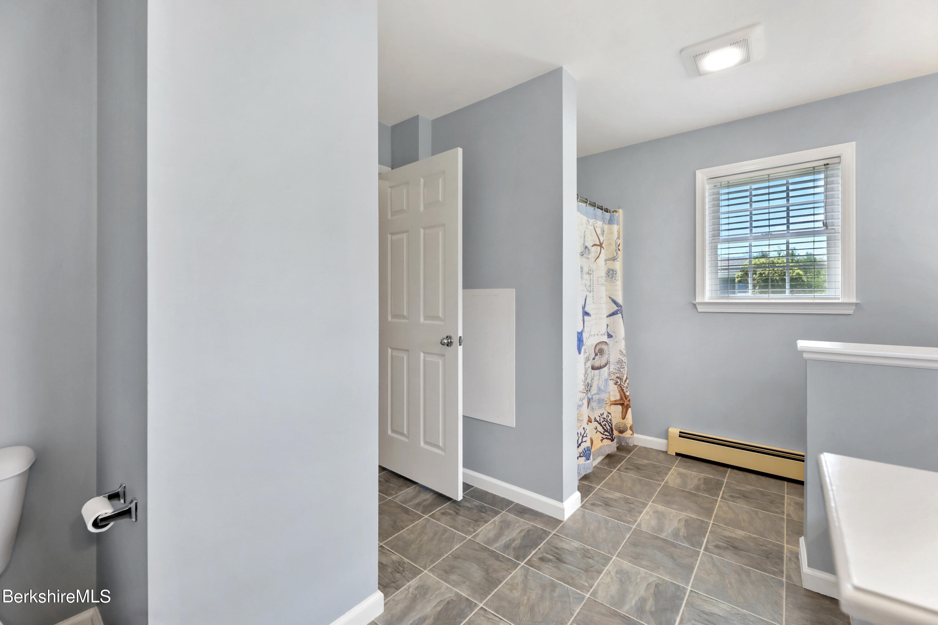 144 East Road Adams, MA 01220 - Photo 25 of 72 a view of an empty room with window and stairs