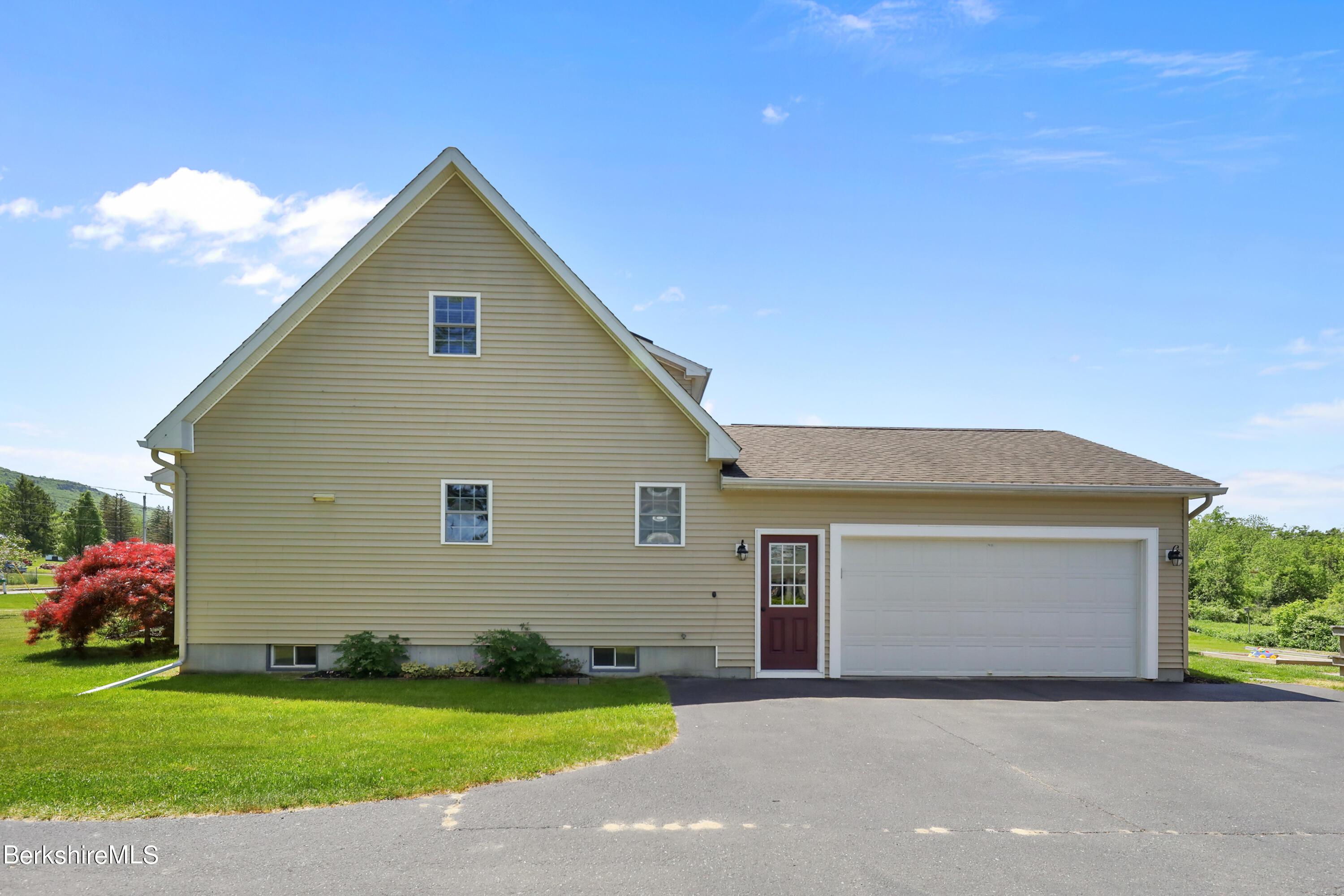 144 East Road Adams, MA 01220 - Photo 58 of 72 a view of a house with a yard and garage