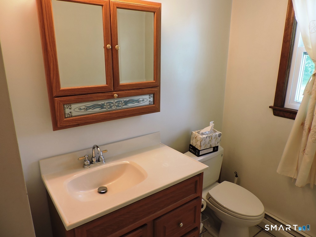 269 Griffin Road South Windsor, CT 06074 - Photo 20 of 36 a bathroom with a sink and a toilet