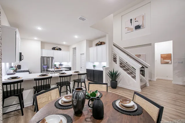 a view of kitchen and dining room with wooden floor