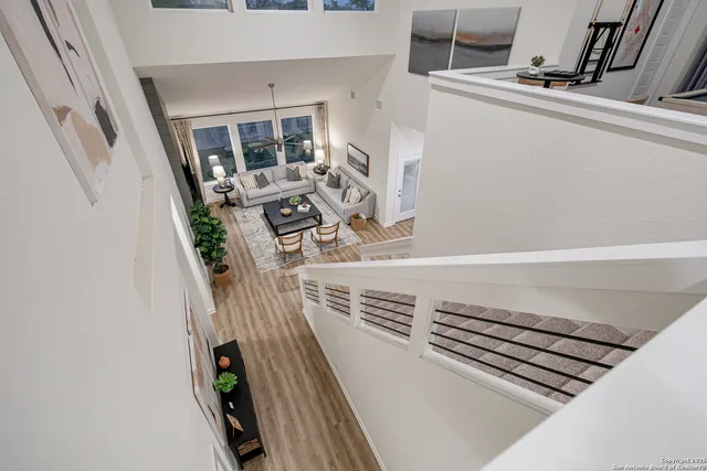 a view of living room with furniture and fireplace