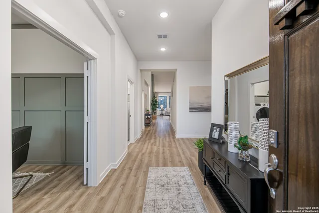 a view of hallway with wooden floor
