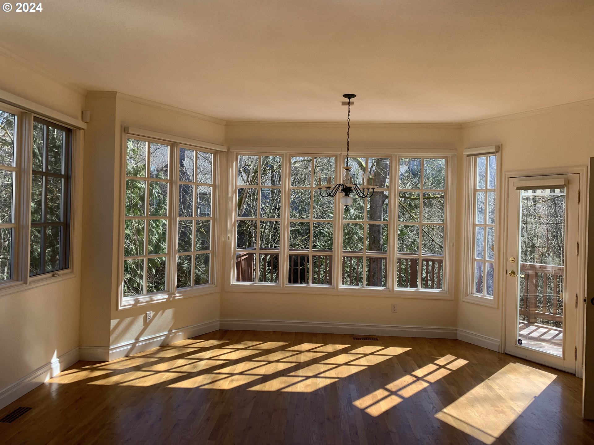 9916 Northwest Abbey Road Portland, OR 97229 - Photo 14 of 48 a view of an empty room with windows