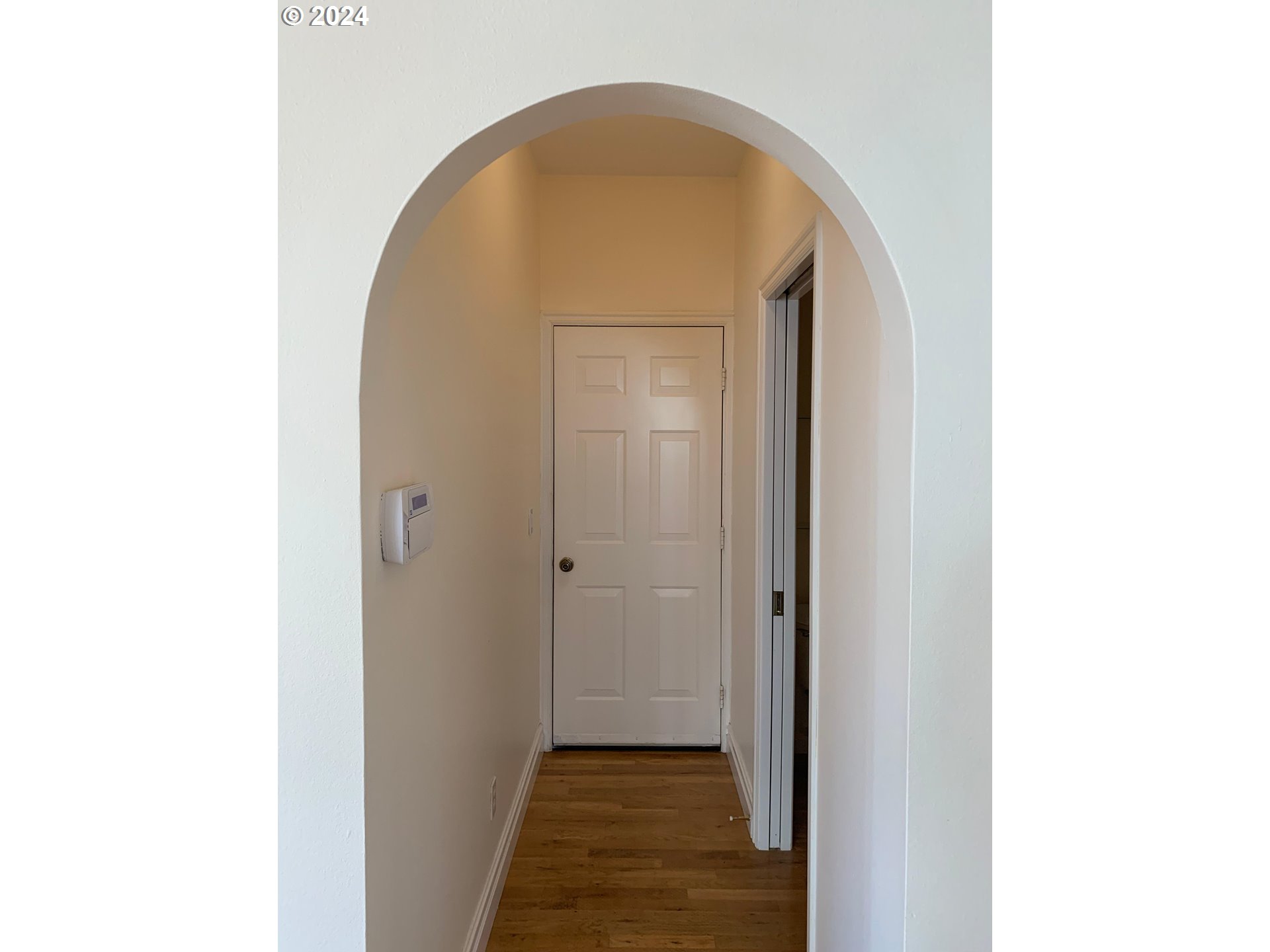 9916 Northwest Abbey Road Portland, OR 97229 - Photo 22 of 48 a view of a hallway with wooden floor