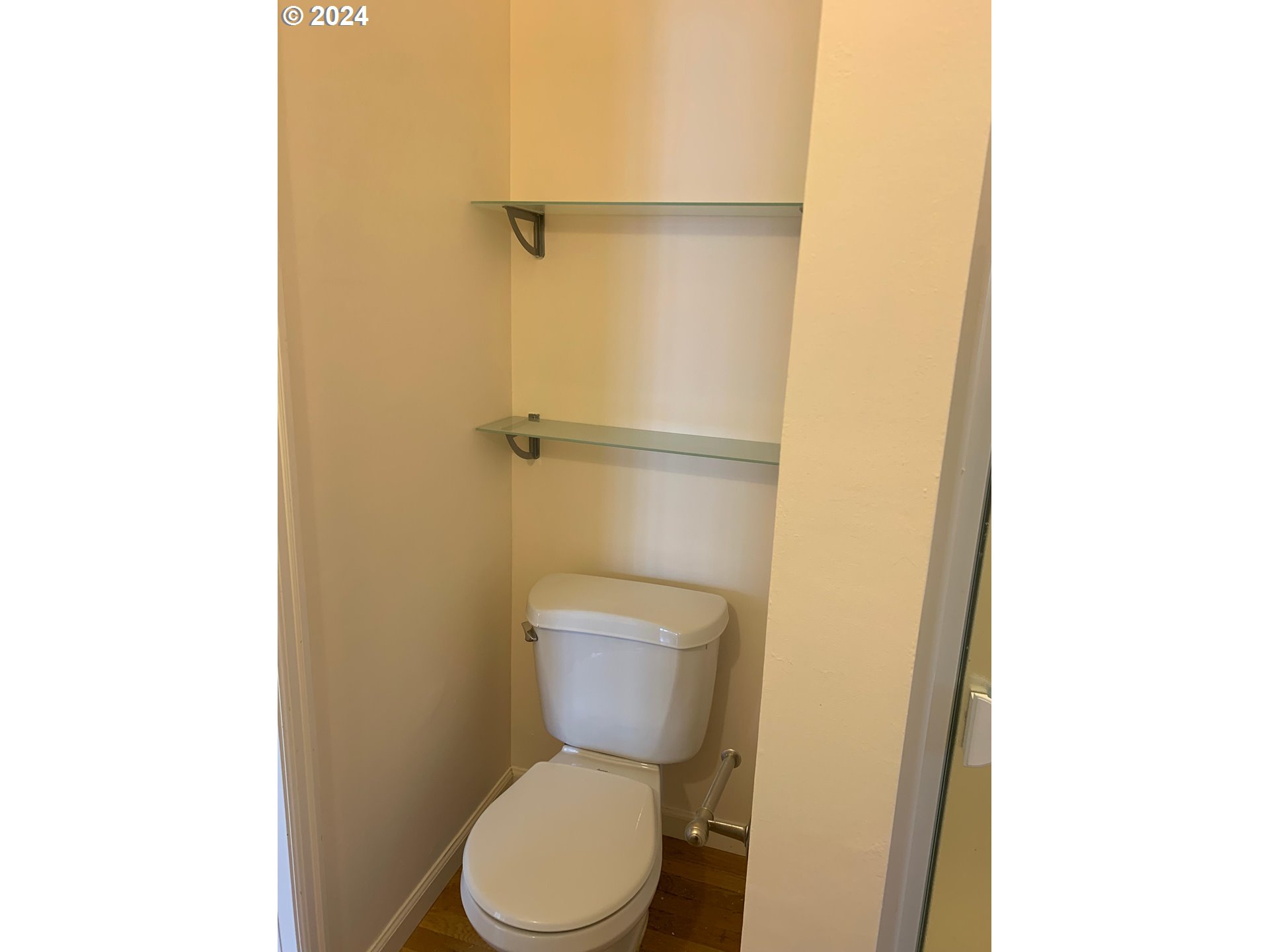 9916 Northwest Abbey Road Portland, OR 97229 - Photo 24 of 48 a white toilet sitting next to a shower