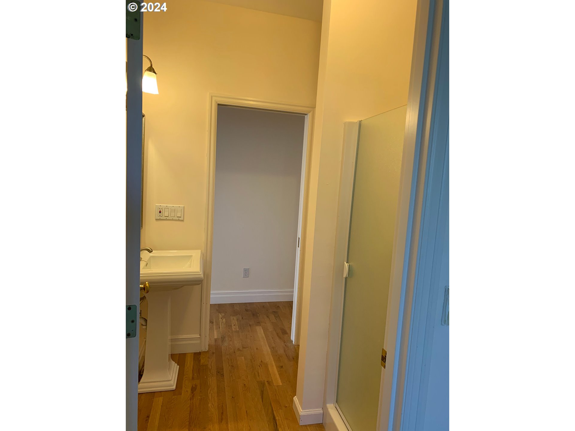 9916 Northwest Abbey Road Portland, OR 97229 - Photo 25 of 48 a view of a bathroom with a sink and a mirror