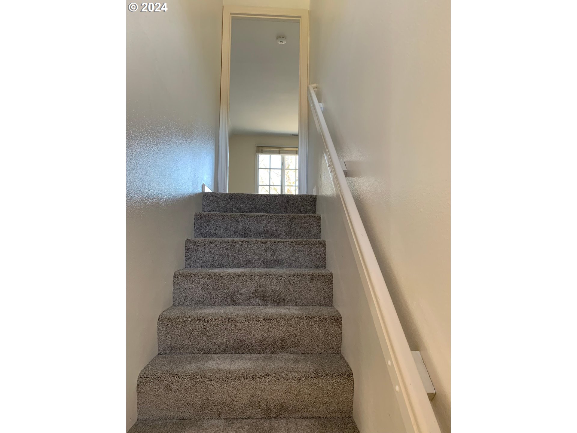 9916 Northwest Abbey Road Portland, OR 97229 - Photo 27 of 48 a view of staircase with white walls and windows
