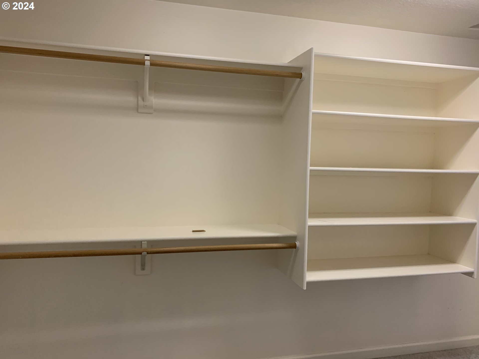 9916 Northwest Abbey Road Portland, OR 97229 - Photo 32 of 48 a view of an empty walk in closet