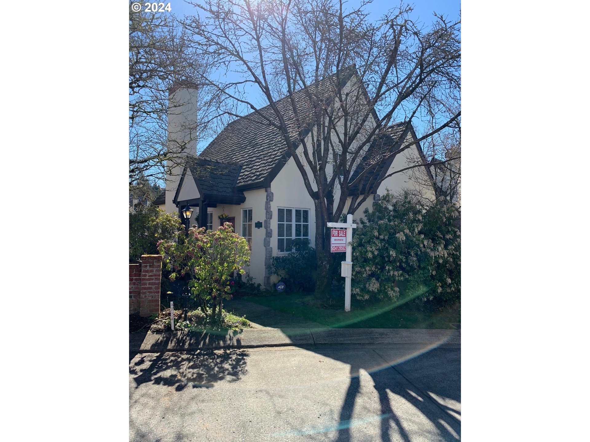 9916 Northwest Abbey Road Portland, OR 97229 - Photo 4 of 48 a front view of a house with garden