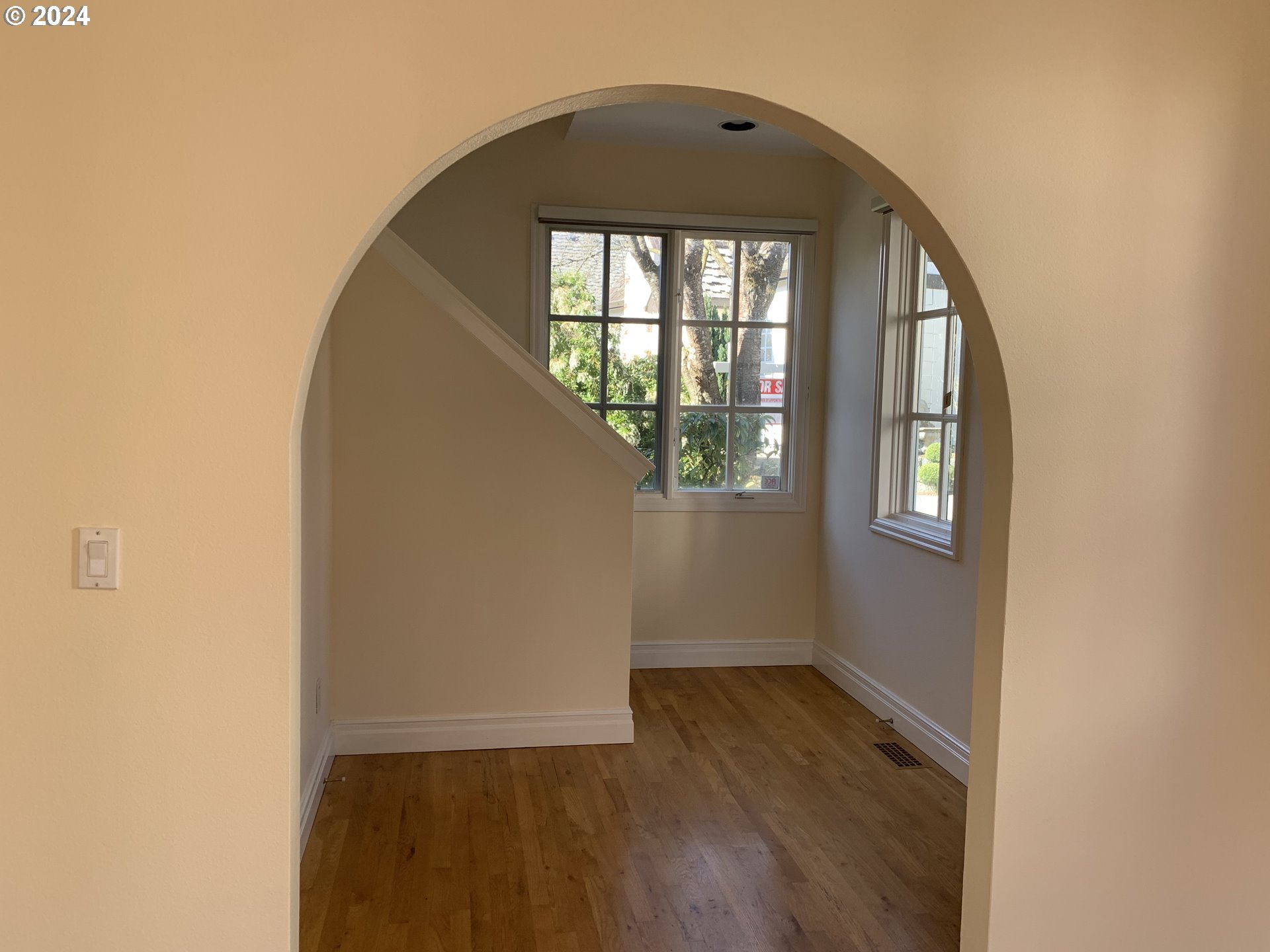 9916 Northwest Abbey Road Portland, OR 97229 - Photo 10 of 48 an empty room with wooden floor and windows