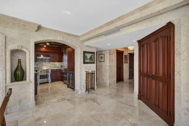 a kitchen with granite countertop stainless steel appliances and wooden cabinets