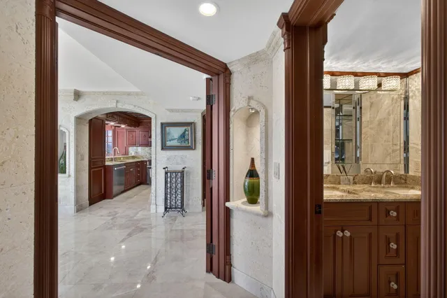 a room with furniture a large window and wooden floor