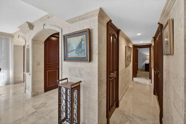 a living room with furniture large window and a table