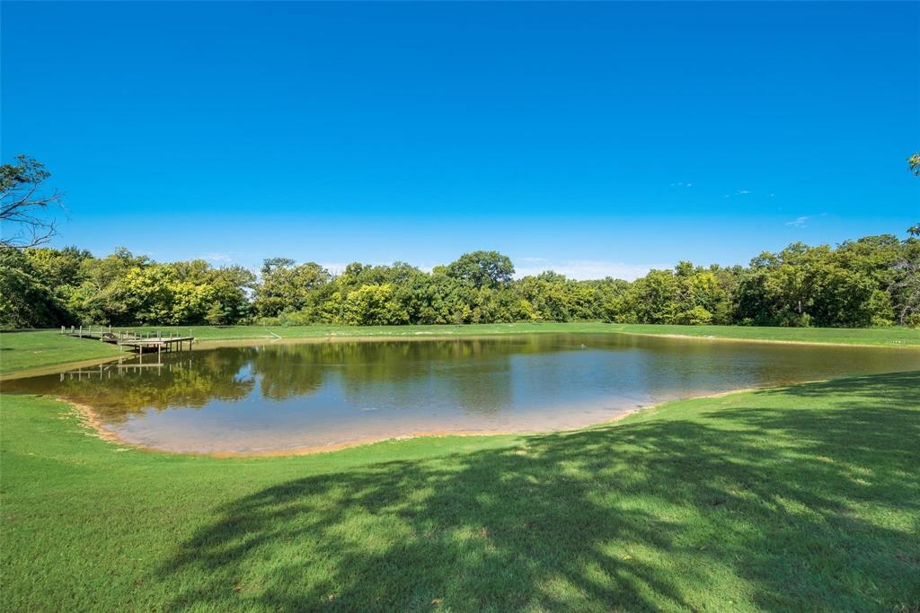 3325 Creek Road Keller, TX 76248 - Photo 14 of 28 a view of a lake with houses in the background