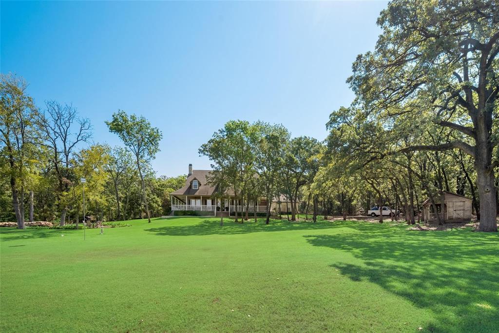 3325 Creek Road Keller, TX 76248 - Photo 2 of 28 a view of a park with large trees