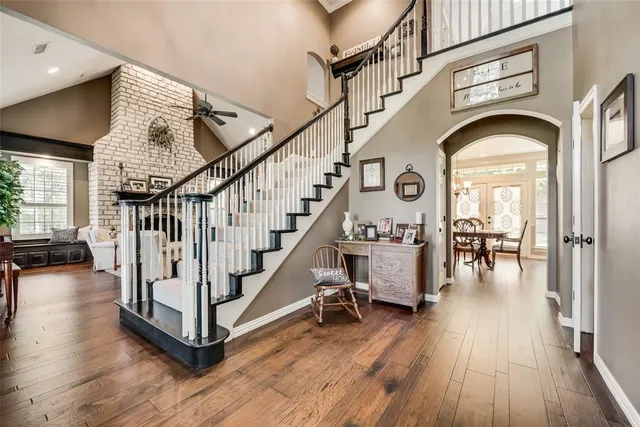 a view of entryway and hall with wooden floor