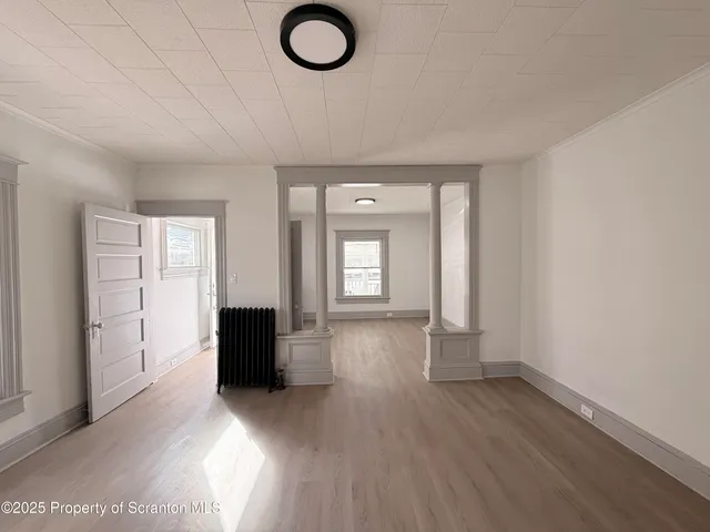 a view of a livingroom with wooden floor